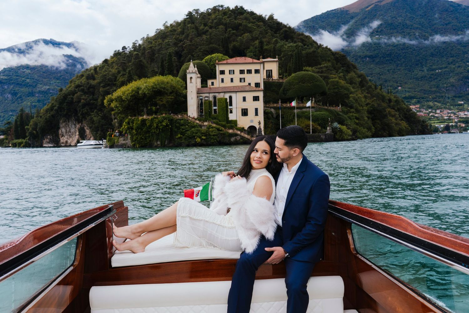 Couple enjoying romantic moments on a sleek white boat.