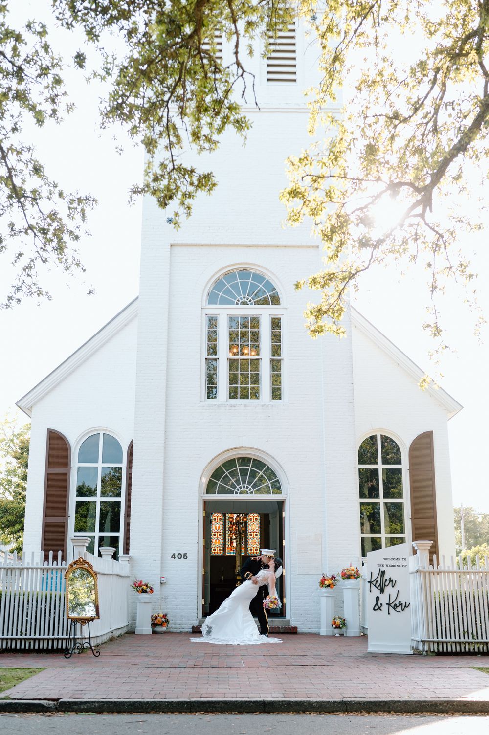 Romantic bride and groom portrait outside Old Christ Church Pensacola