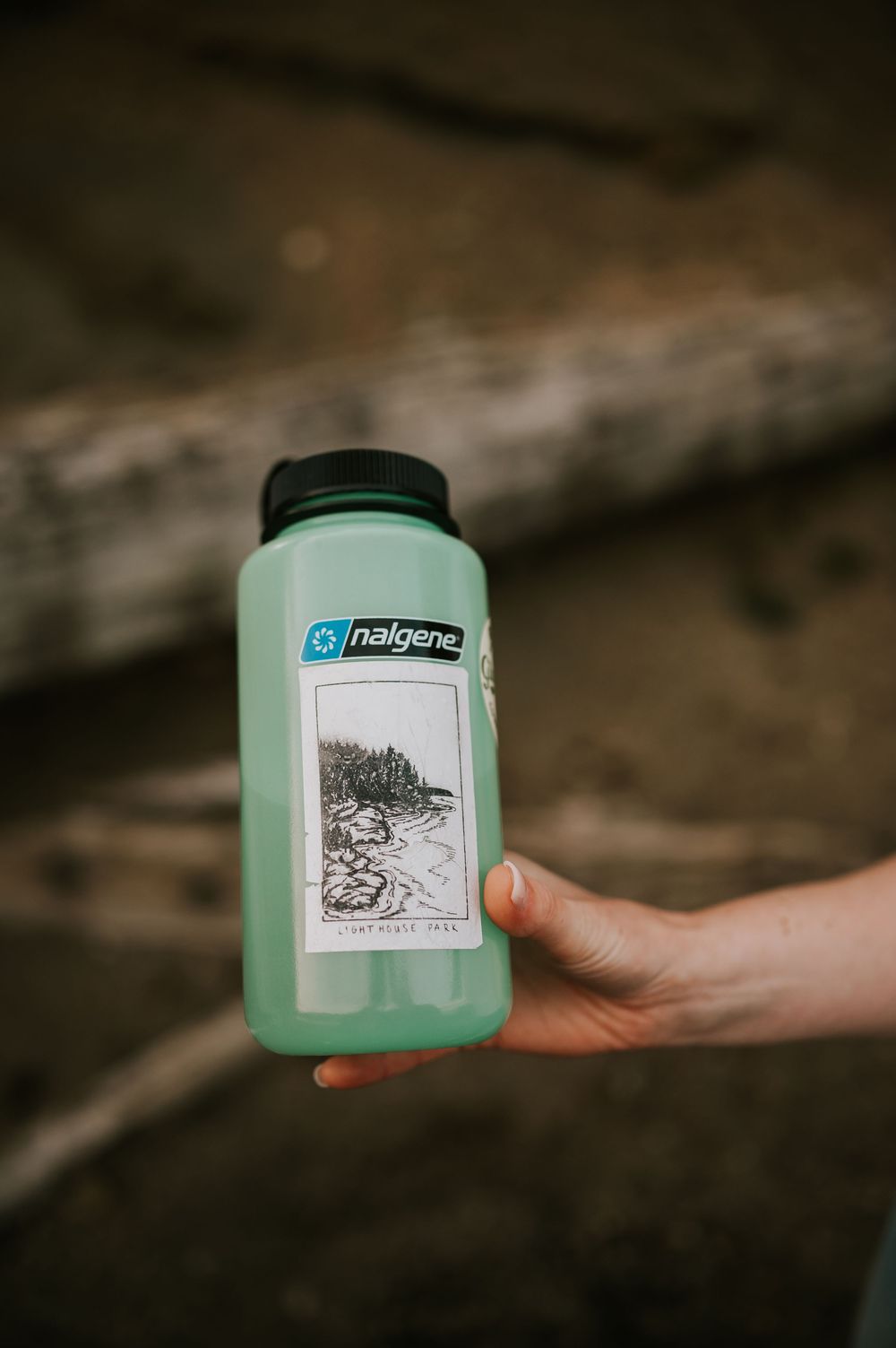 Close-up of water bottle with special meaning in couple’s story, photographed during Comox Lake engagement session