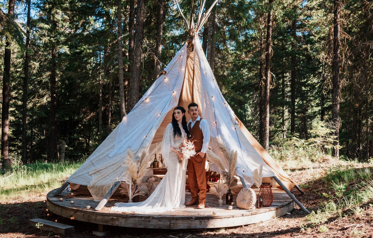 A beautifully styled boho teepee adorned with pillows, macrame, and florals, perfect for whimsical engagement or wedding Mount Rainier