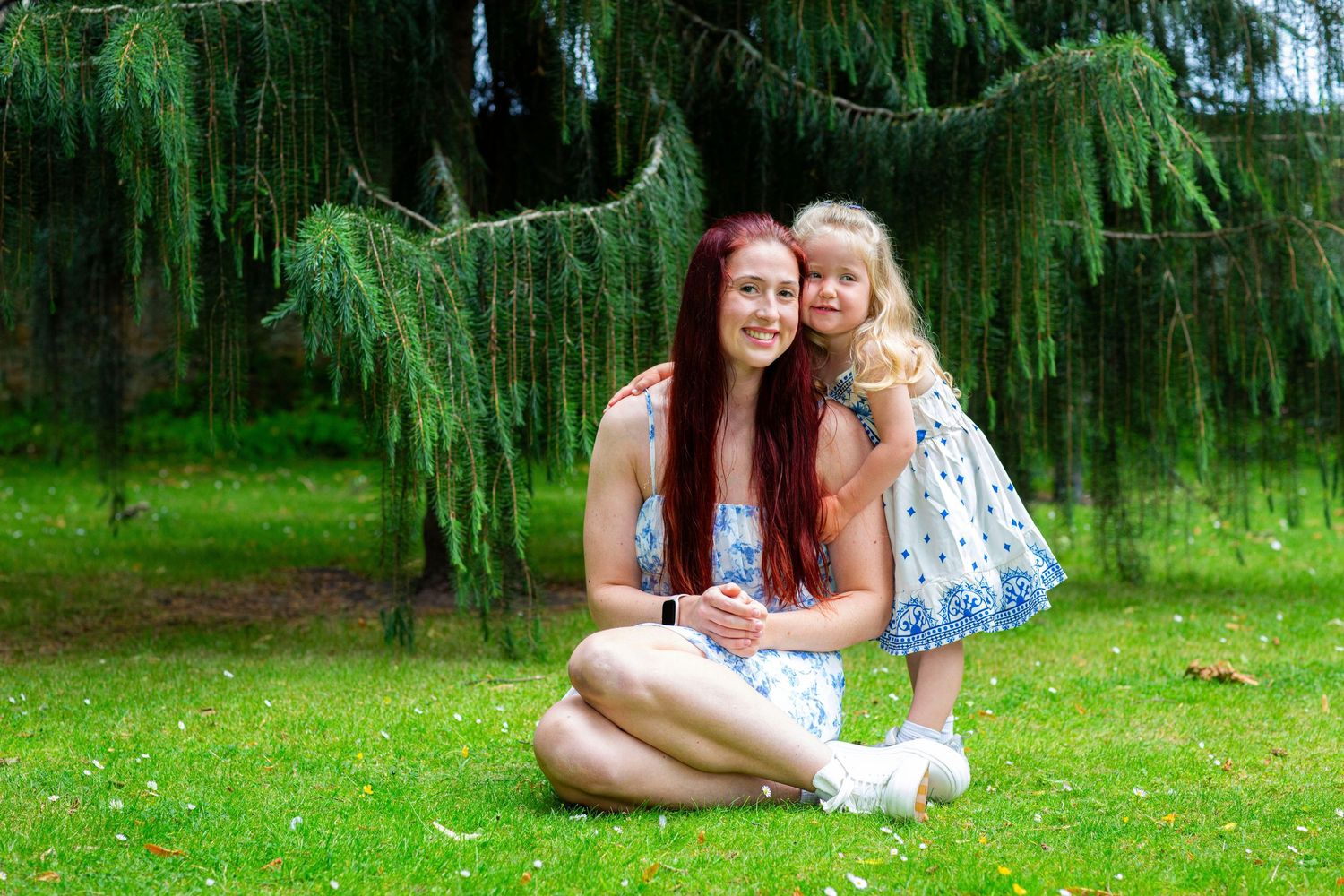 A loving mother and daughter smiling to the camera, at the Elgin biblical gardens.
