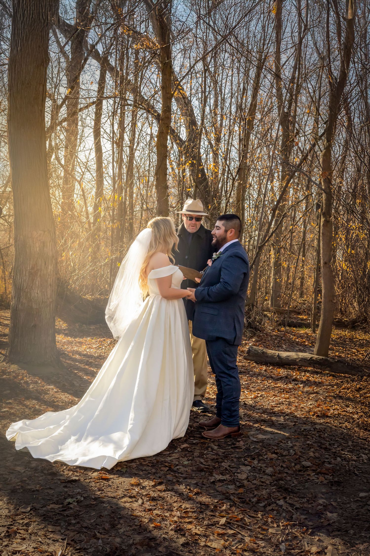 Boise Elopement ©Milestones Studios LLC Bride and groom with officiant during vows