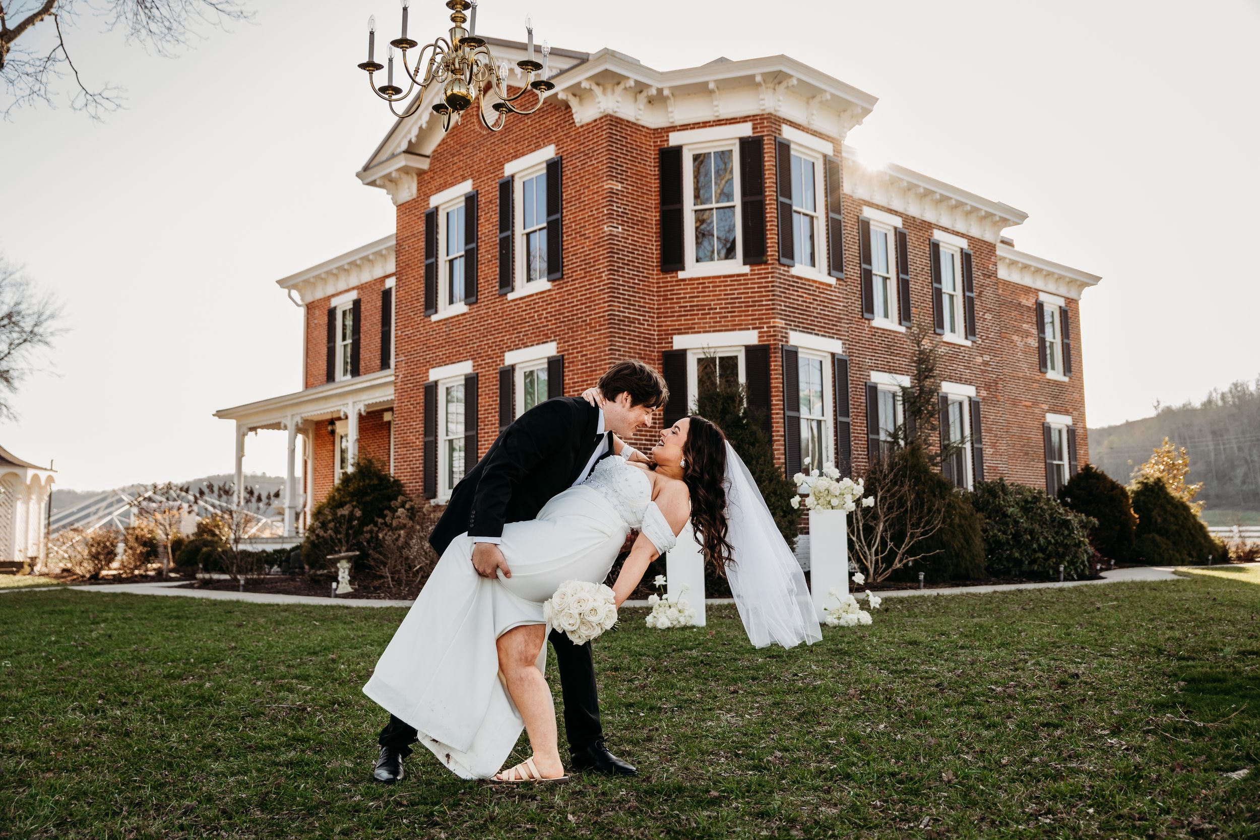 Bride and Groom share a dip on the lawn of the Historic Woodlawn Mansion in WV.