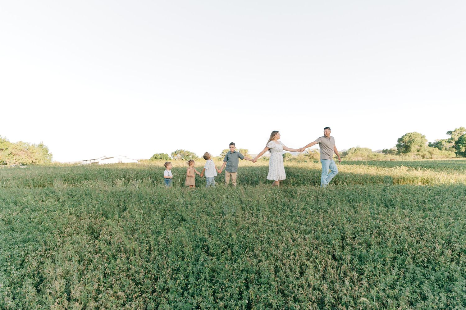 Peoria family photographer capturing outdoor portraits at a lush greenery location in Arizona
