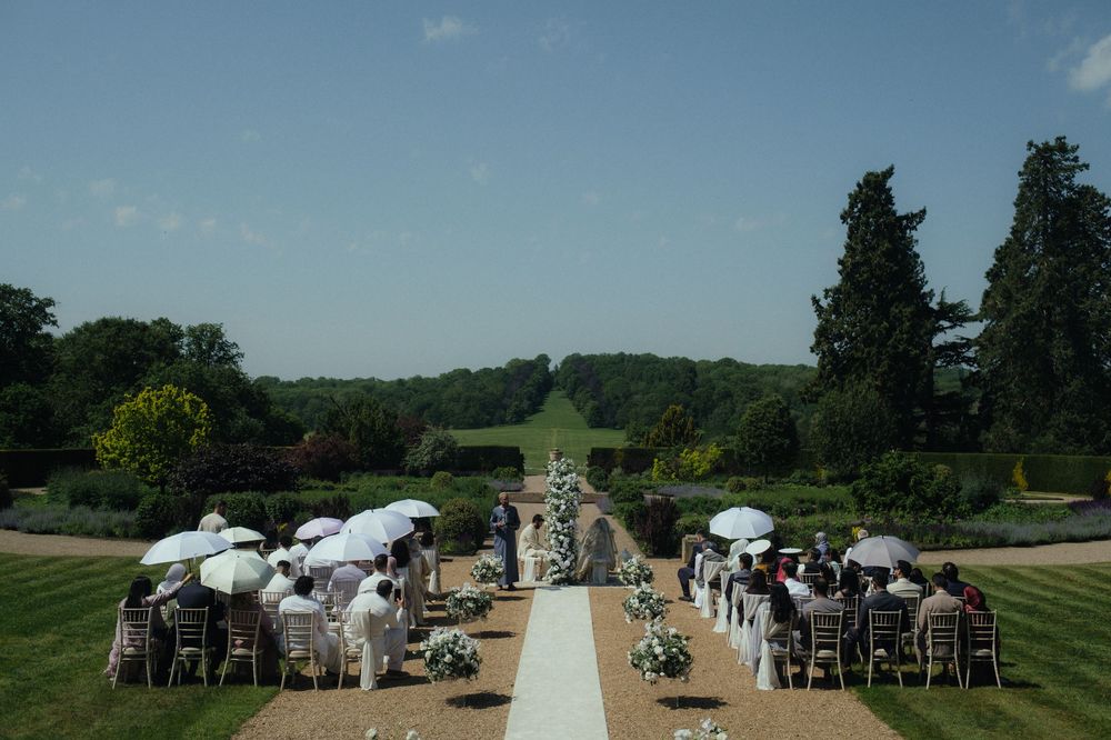 Outdoor nikah, wedding ceremony at Ragley Hall on hot summer day.