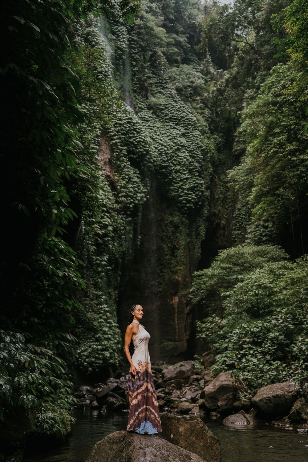 Natural family photography surrounded by tropical greenery at Sekumpul Waterfall