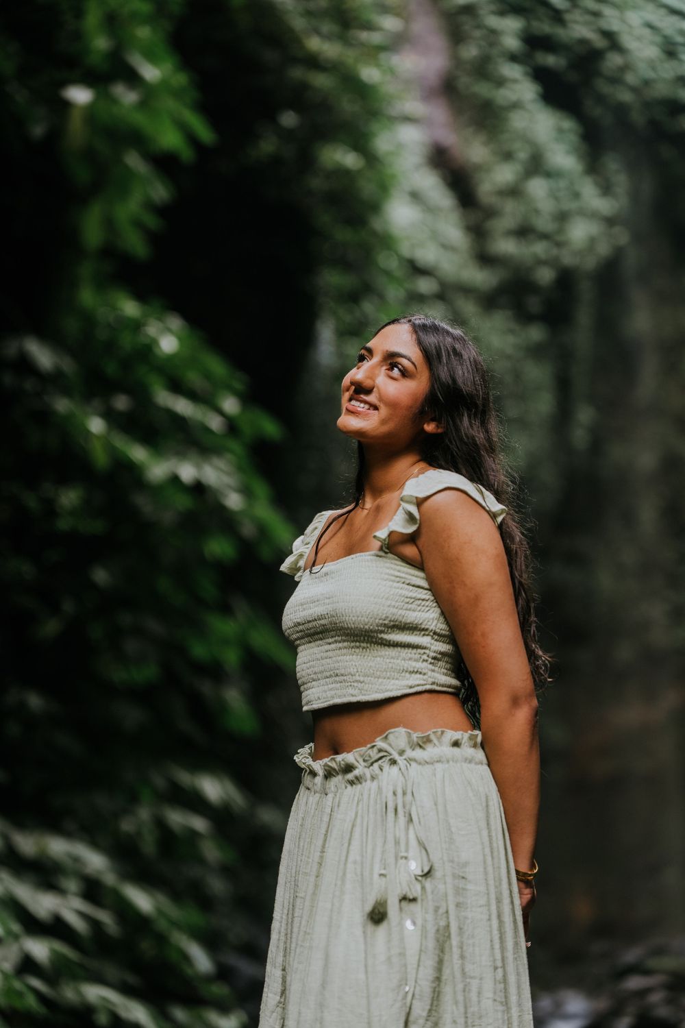Natural family photography surrounded by tropical greenery at Sekumpul Waterfall