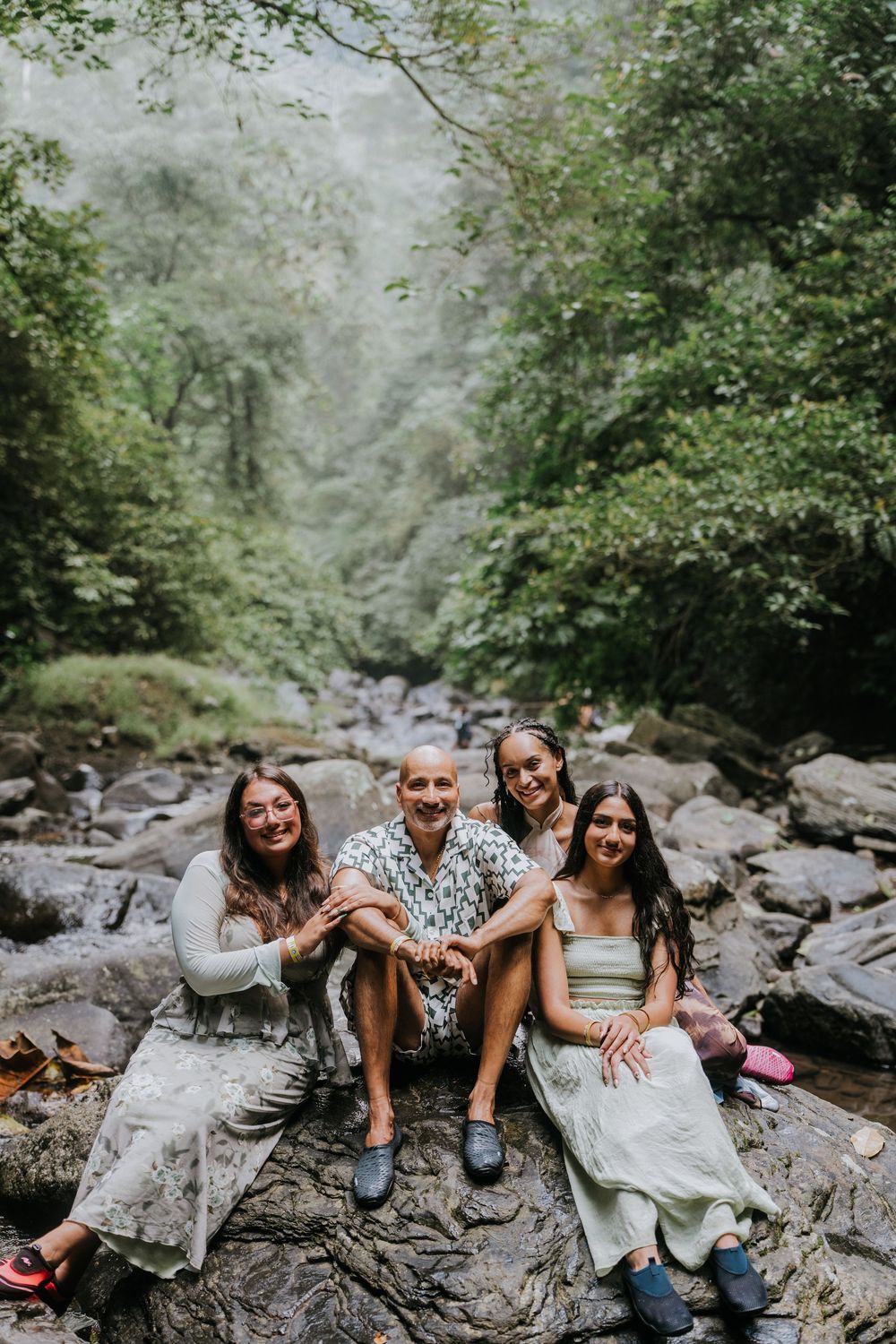 Natural family photography surrounded by tropical greenery at Sekumpul Waterfall