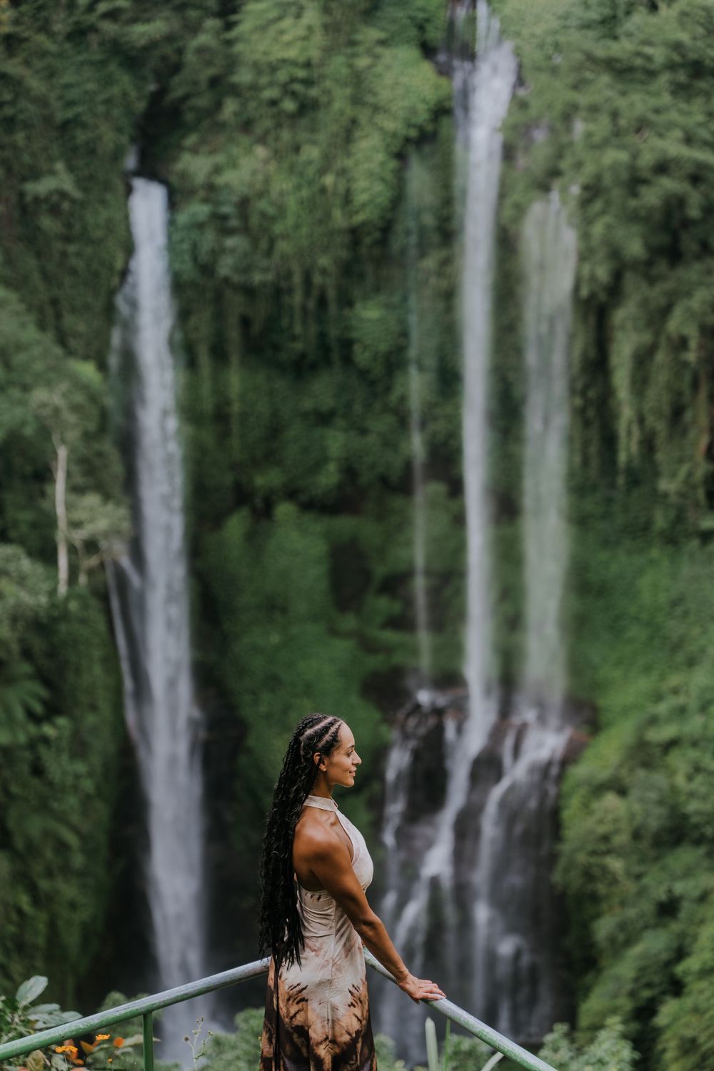 Natural family photography surrounded by tropical greenery at Sekumpul Waterfall