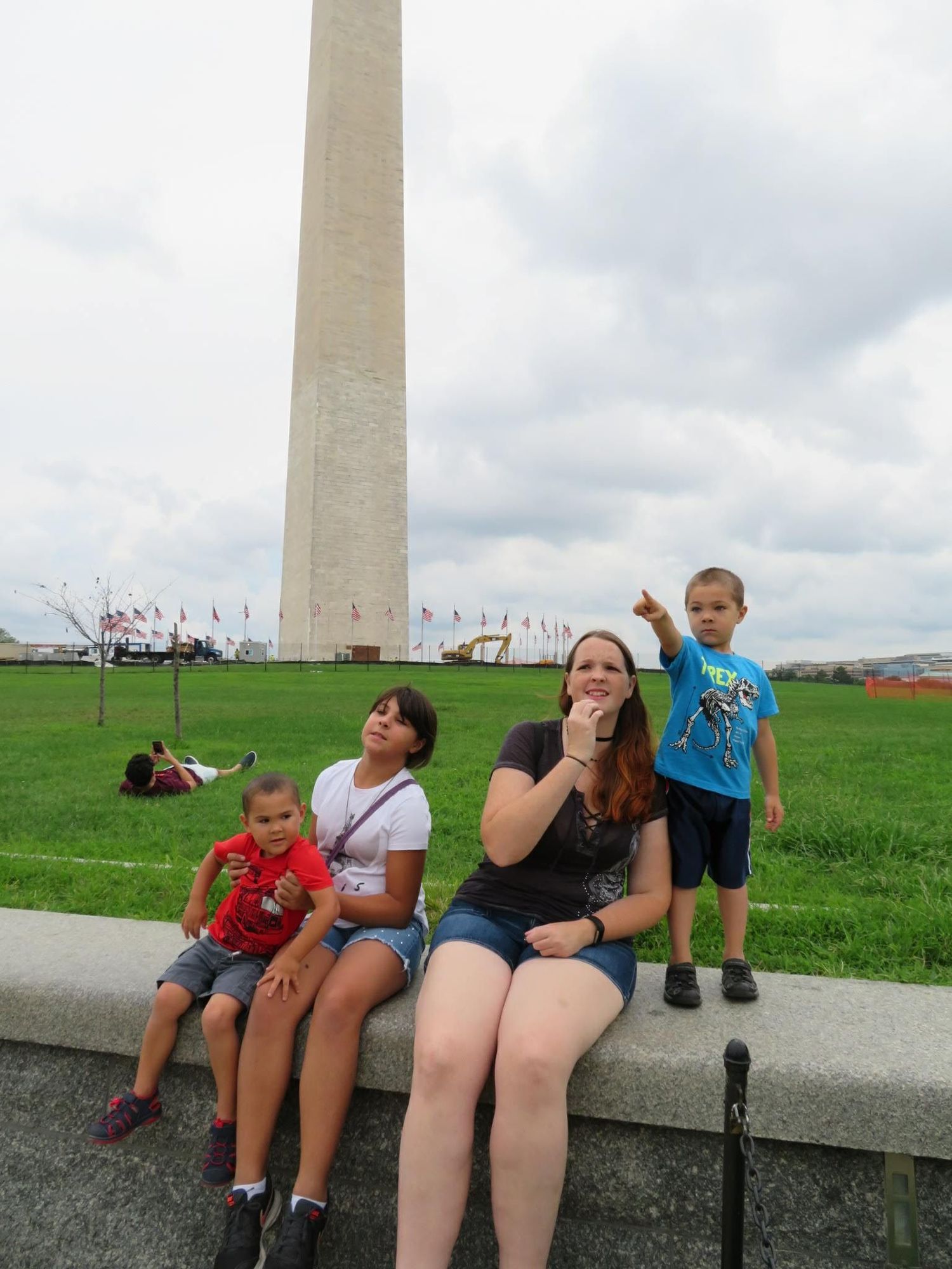 Family enjoying time together near the Washington Monument during a family vacation.
