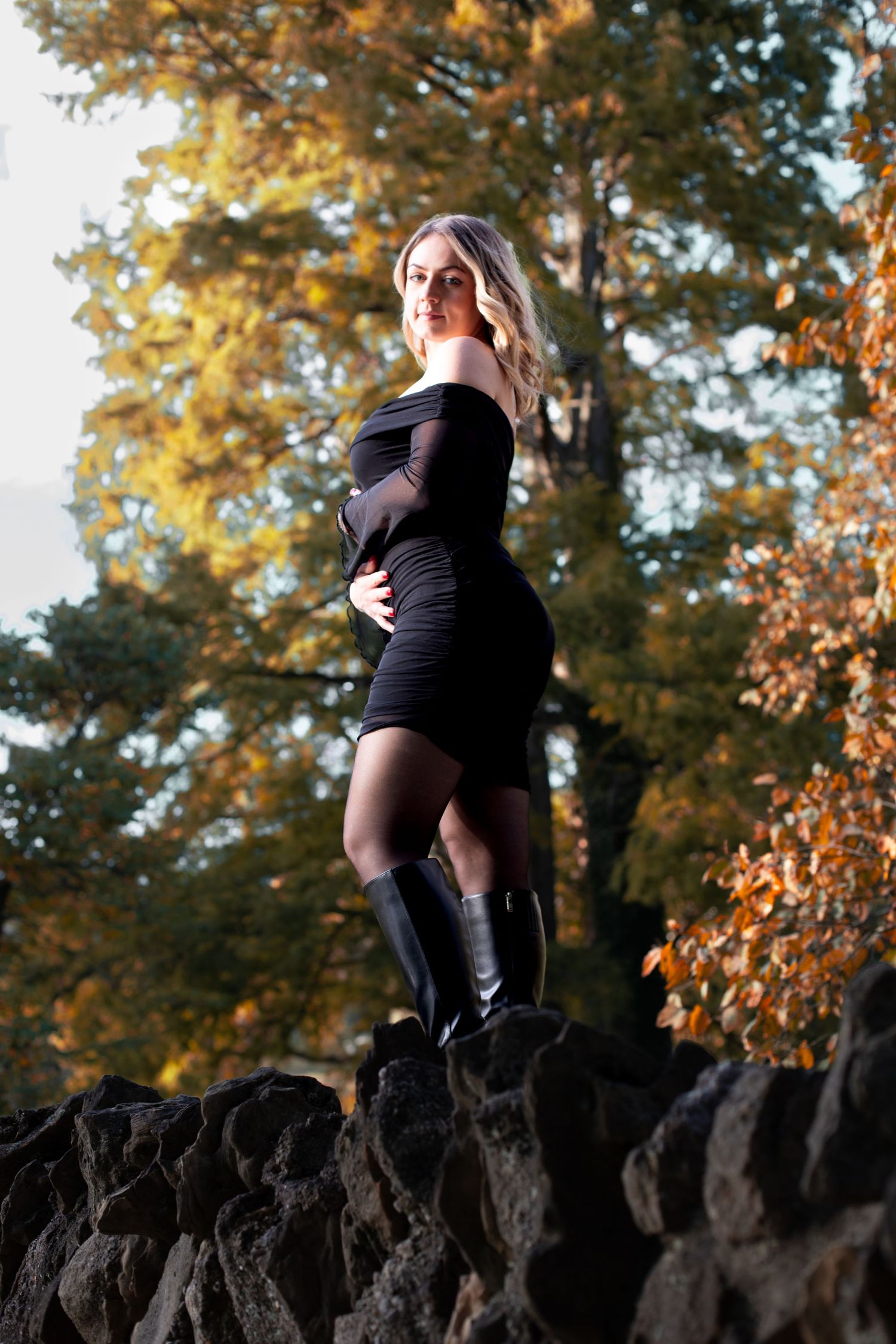 Cincinnati photographer capturing fall portrait at Sharon Woods Park with golden leaves, natural light, and a beautiful autumn backdrop