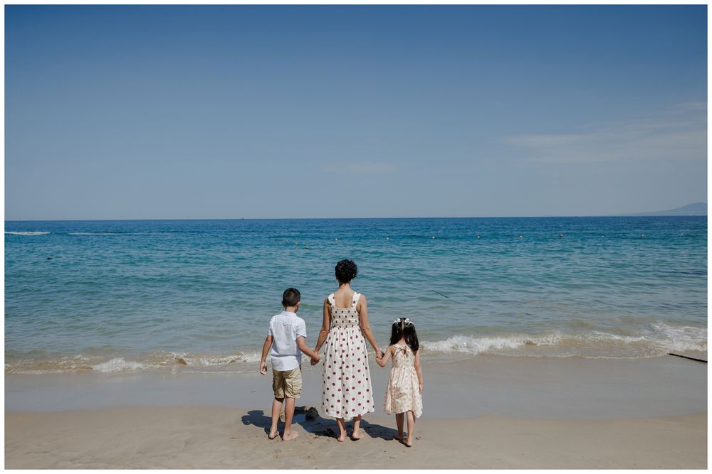 Hyatt Ziva Puerto Vallarta Family Photographer capturing a mother with her children by the ocean during Lifestyle Family Photography.