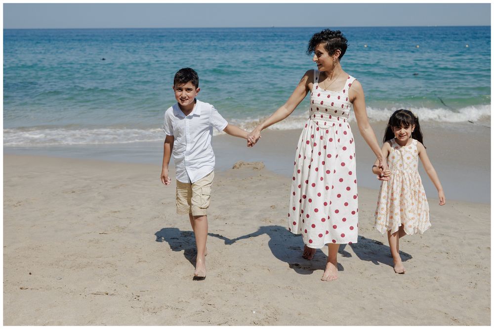 Hyatt Ziva Puerto Vallarta Family Photographer capturing a mother walking with her children on the beach during Family Photo Session.