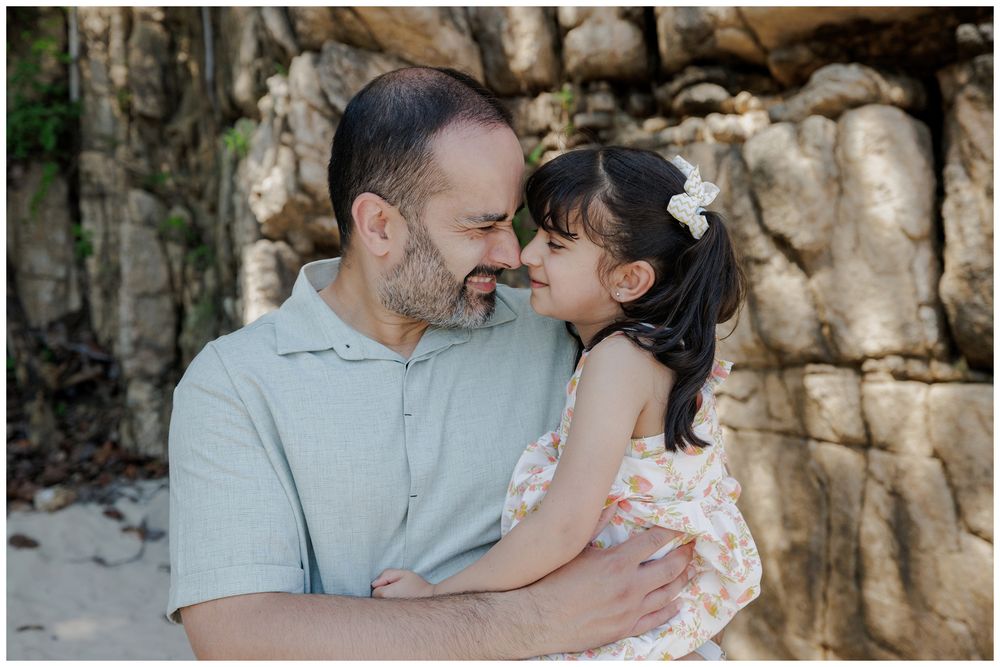 Hyatt Ziva Puerto Vallarta Family Photographer capturing a father and daughter sharing a quiet moment during Beach Family Photos.