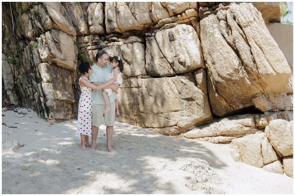 Hyatt Ziva Puerto Vallarta Family Photographer capturing a couple embracing on the beach during Beach Family Photos.