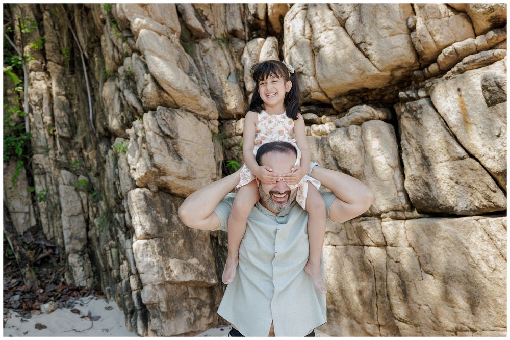 Hyatt Ziva Puerto Vallarta Family Photographer capturing a father and daughter sharing a playful moment during Sunset Family Photos.