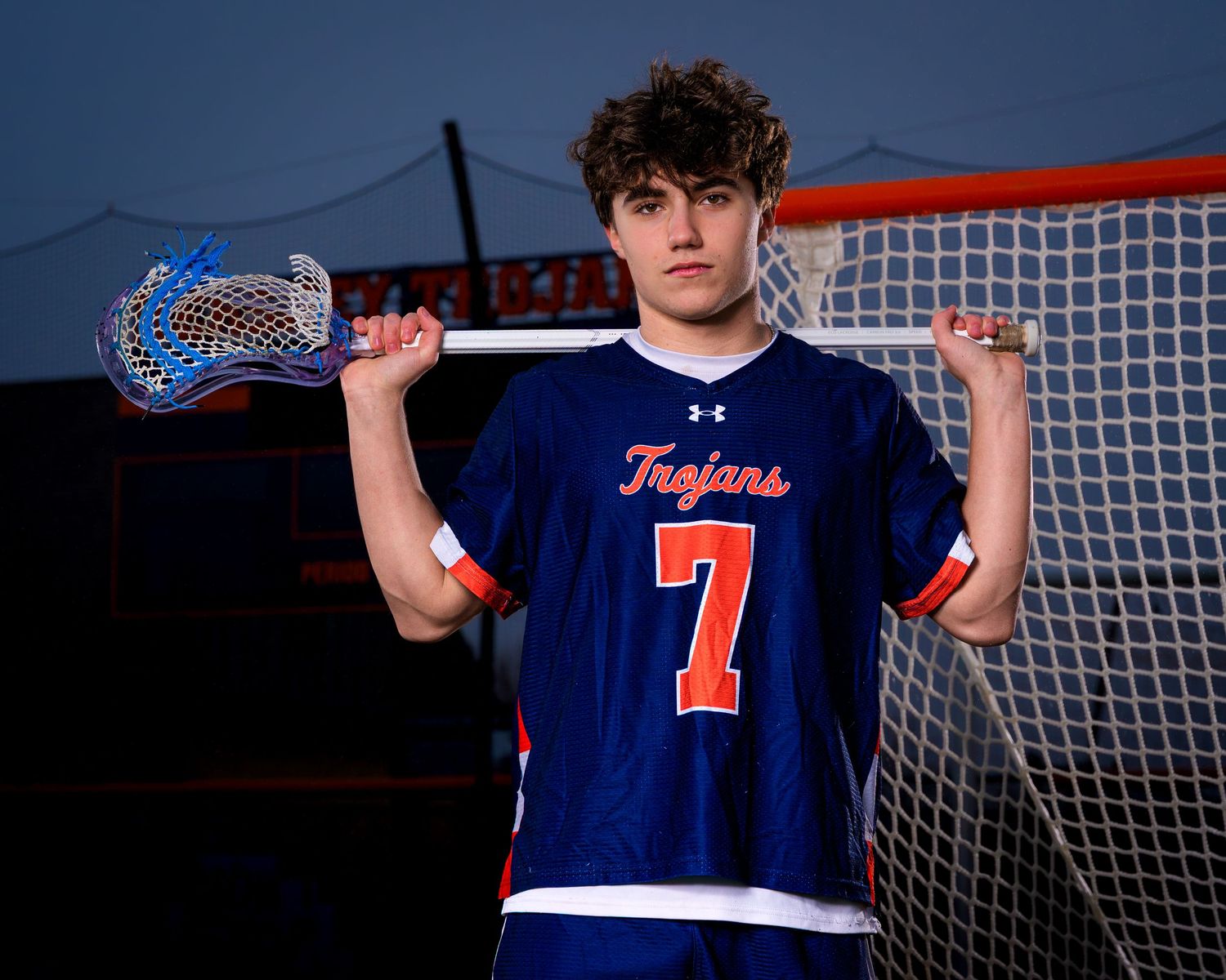 Hershey Trojans boys lacrosse player #7 photo day portrait at the goal, by Deanna Fox, SportsFox Photography based in Hershey PA