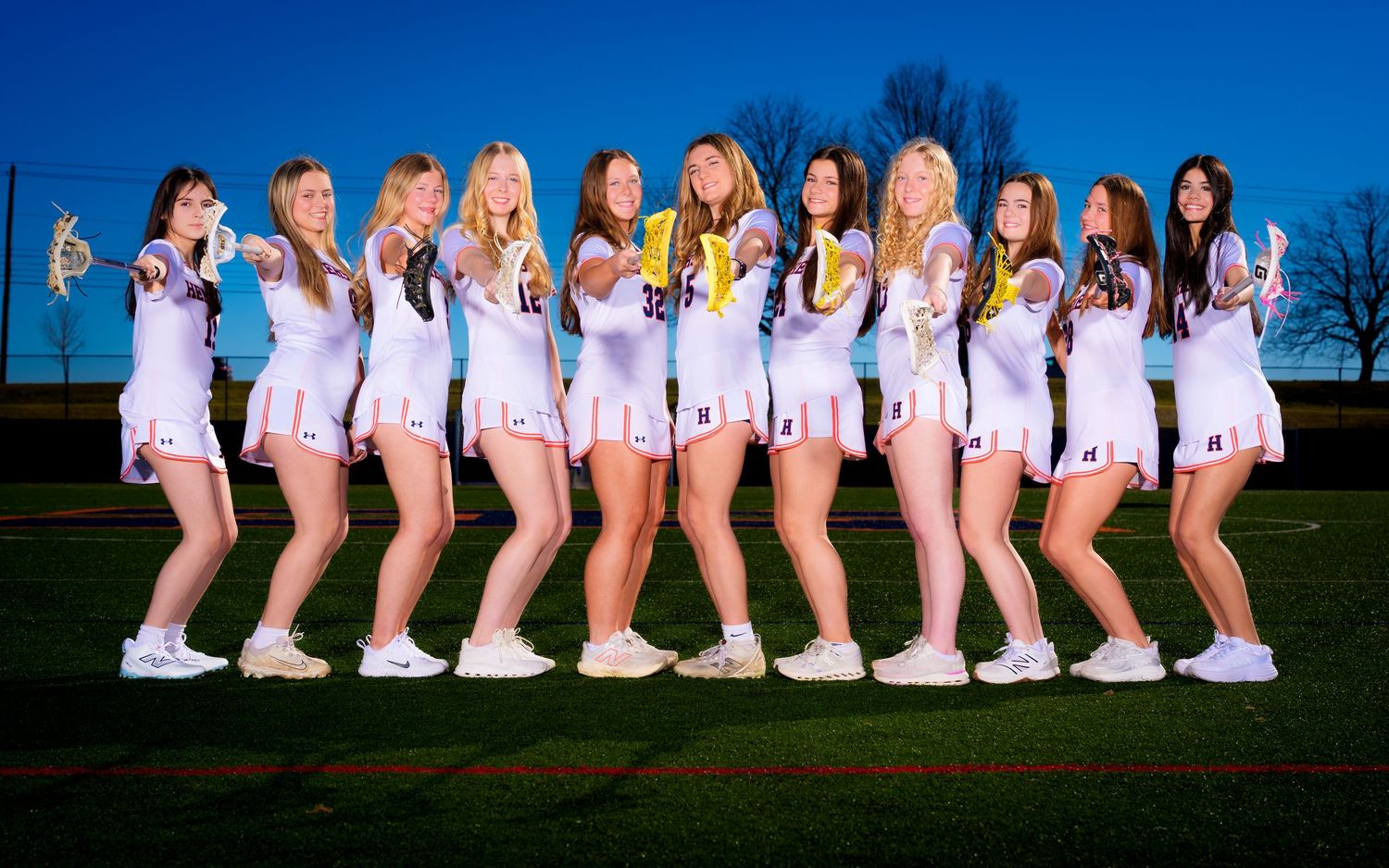 Hershey Trojans girls lacrosse team lined up for a 2026 photo day portrait, by Deanna Fox, SportsFox Photography based in Hershey PA