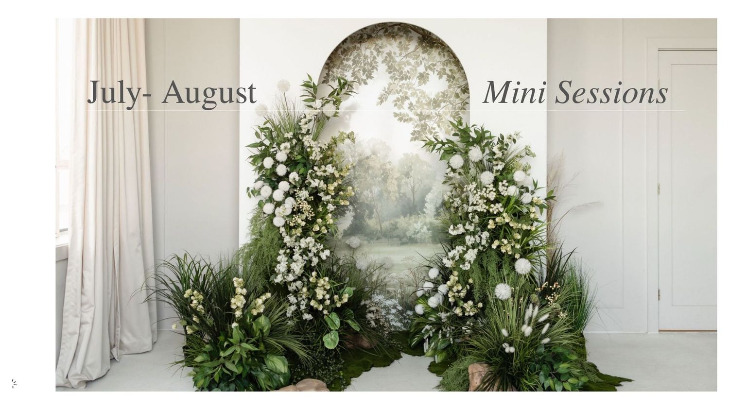 Elegant floral arch with white flowers and greenery for July-August mini photography sessions in a bright studio.
