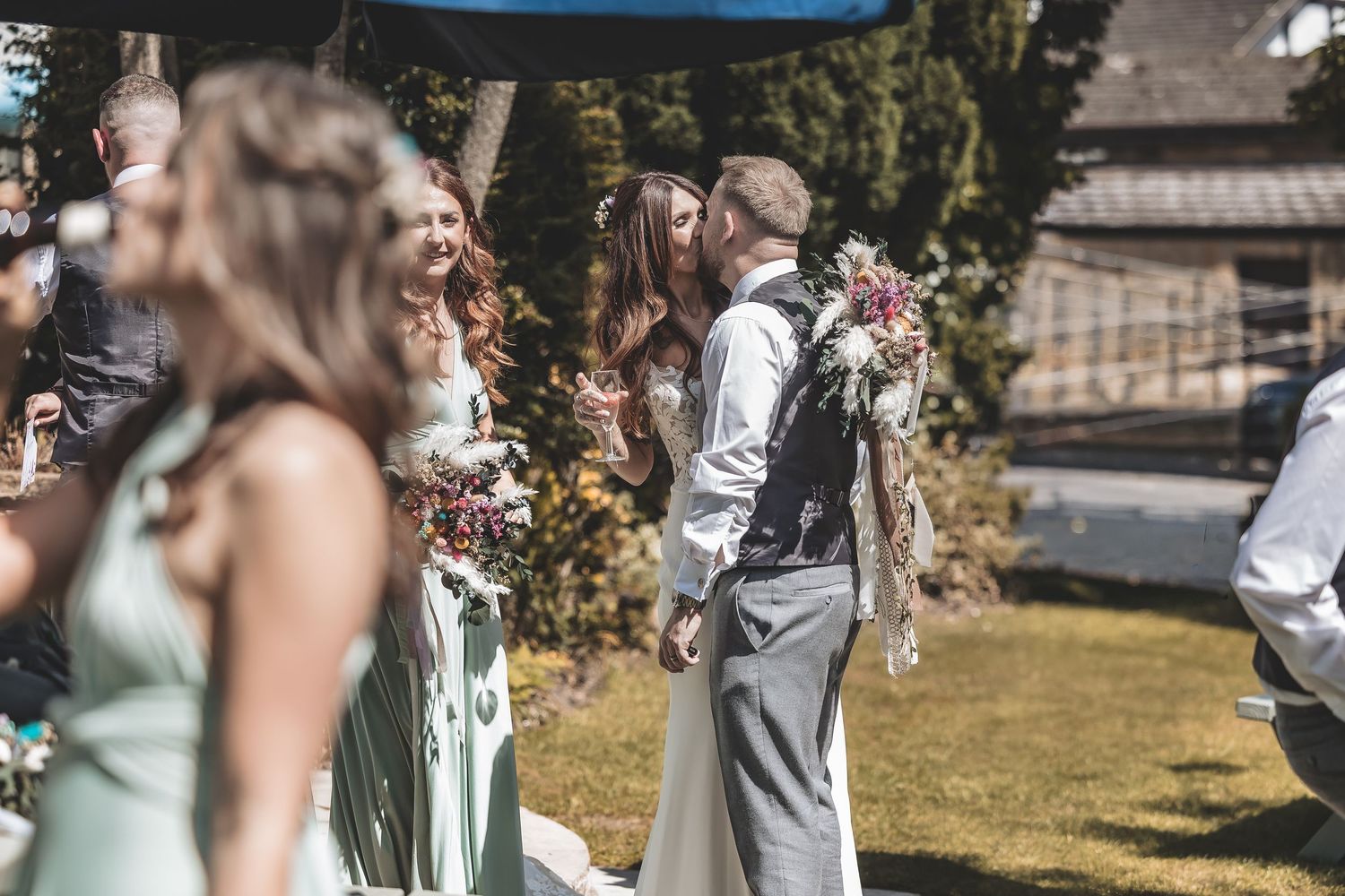 Bride and groom sharing a moment together during drinks reception captured by a second shooter