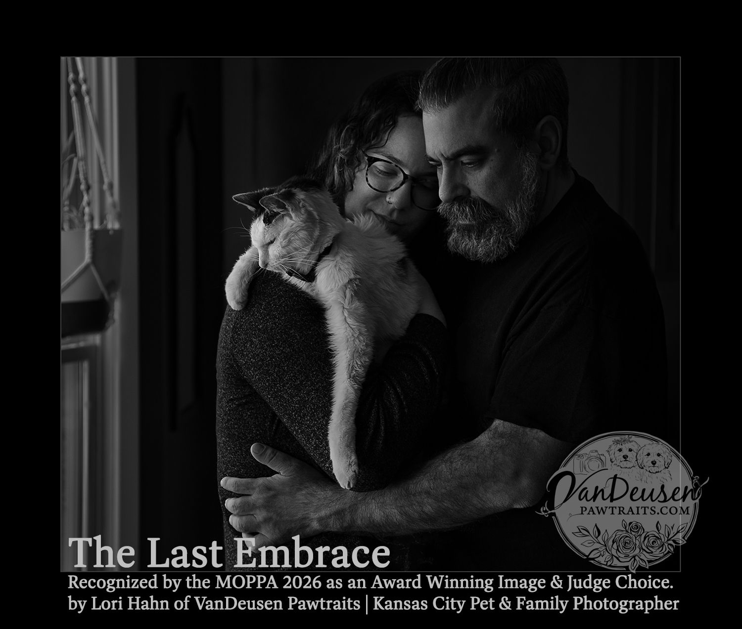 Black and white photo of a couple tenderly holding a cat, titled The Last Embrace, an award-winning image by VanDeusen Pawtraits.