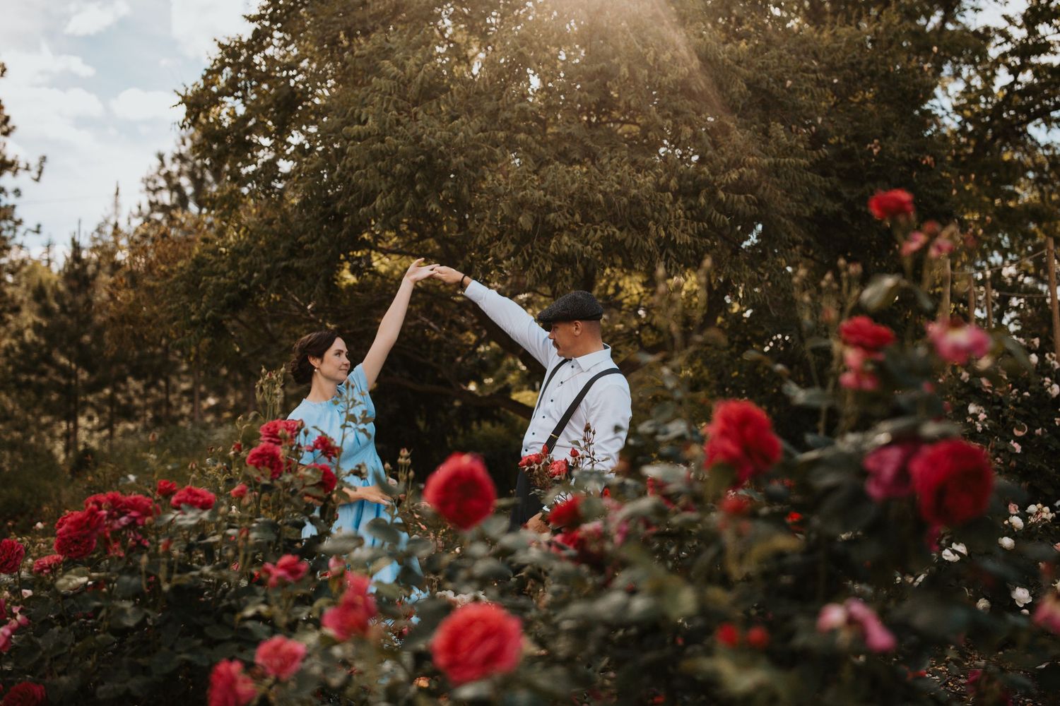 Mom & Dad dancing in family photo surrounded by flowers in the South Okanagan
