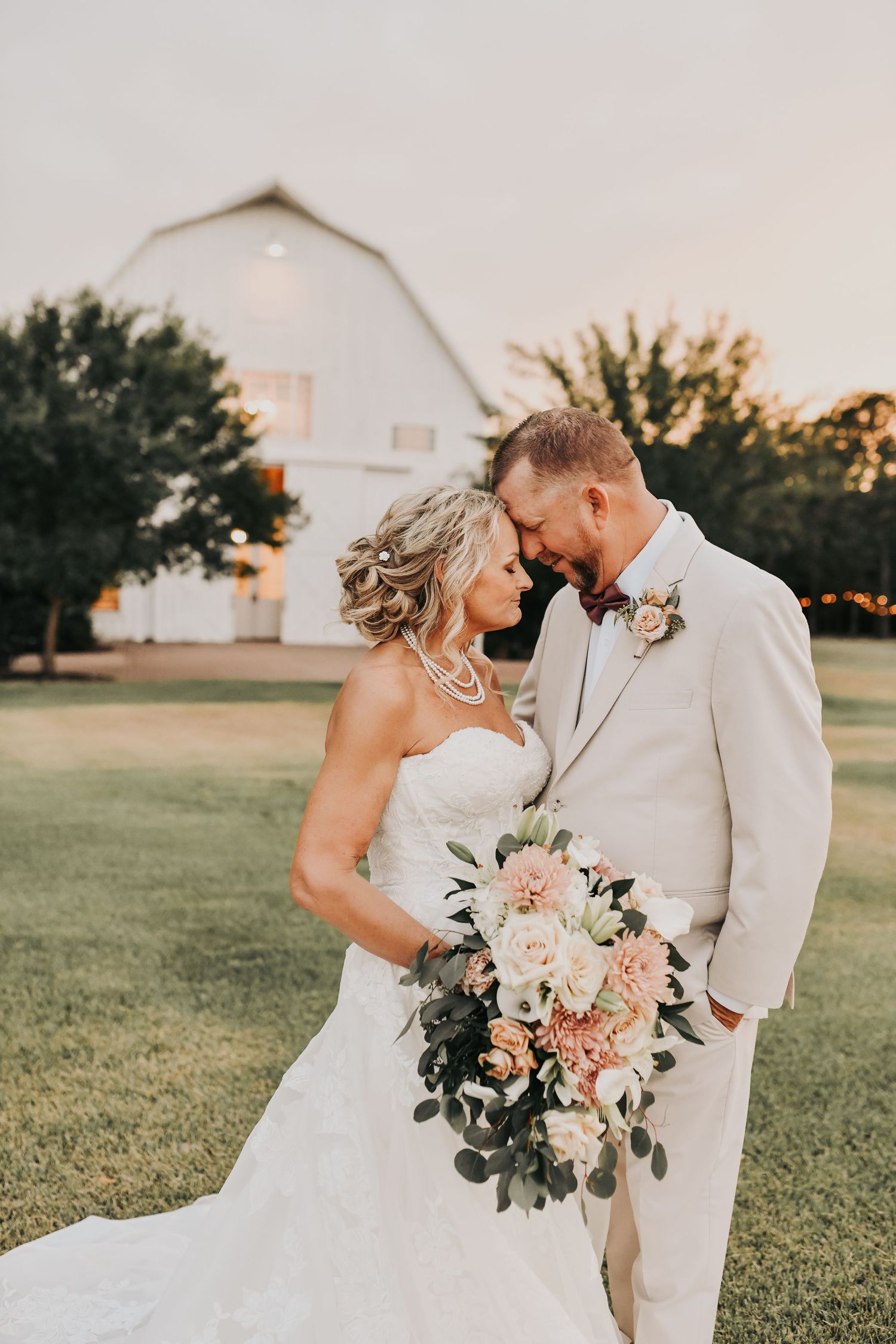 Bride and groom holding hands during golden hour at The White Sparrow wedding venue