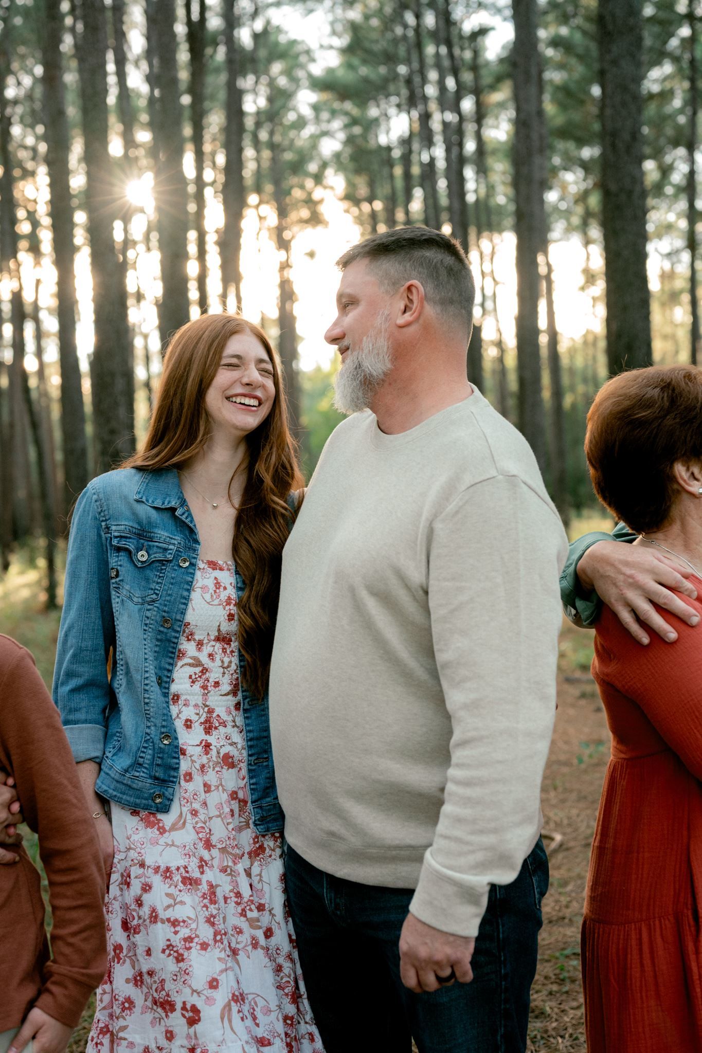 Father and teen daughter sharing a laugh.