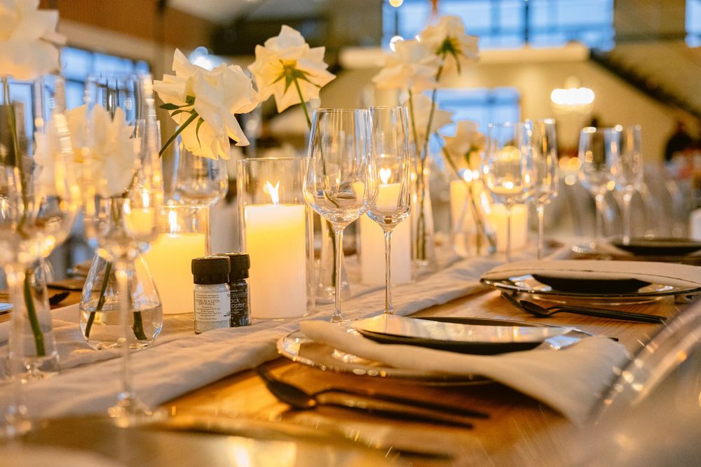 Romantic reception space decorated with candles, flowers and soft lighting