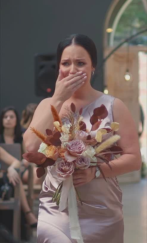 Emotional reaction as the bride walks down the aisle.
