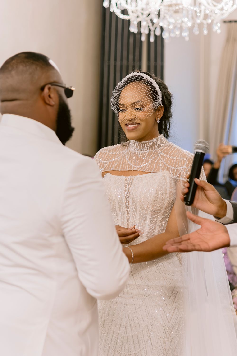 Bride and groom exchanging vows during an emotional wedding ceremony.