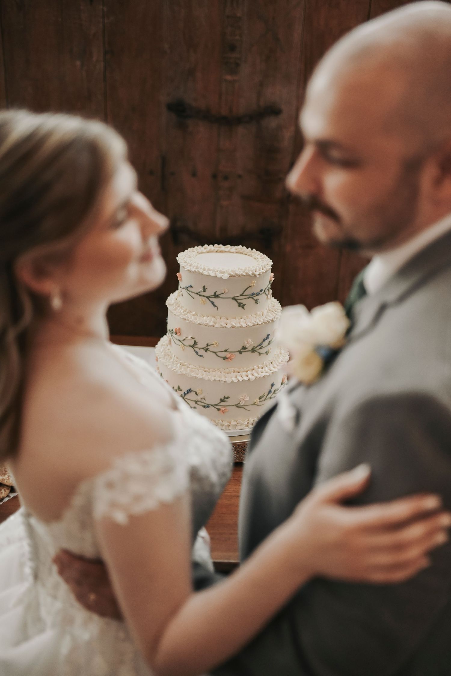 Parker and Kathryn cutting their wedding cake during their reception