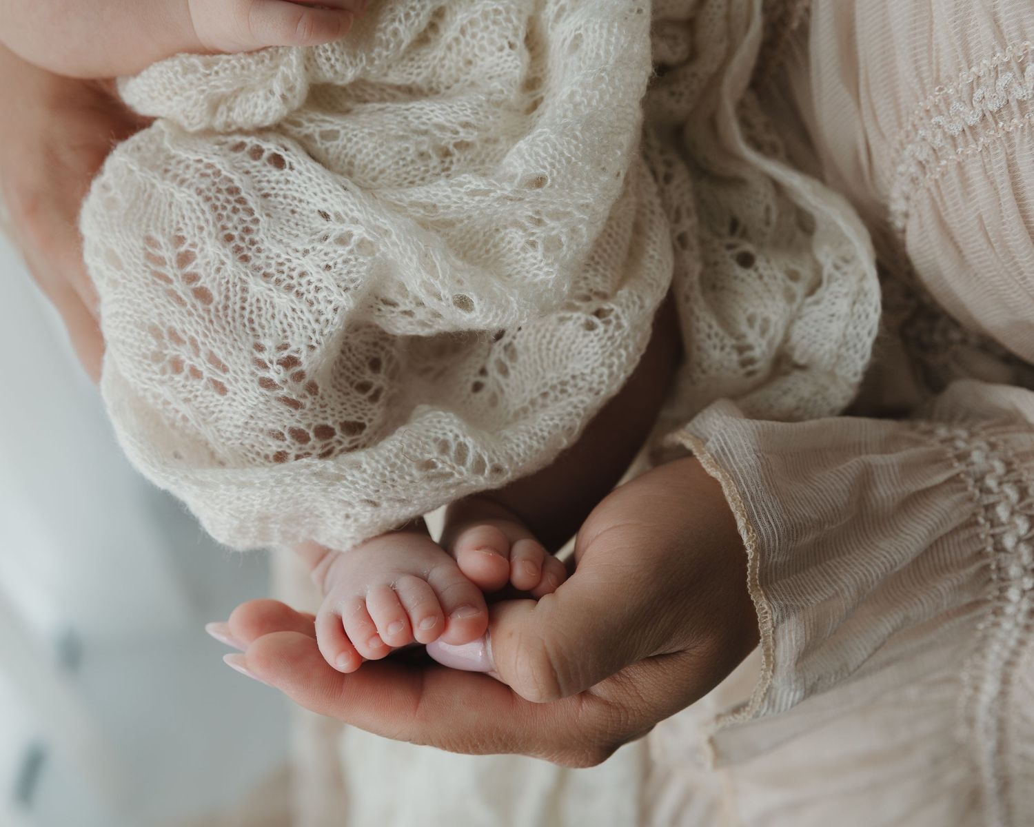 Detail shot of newborns feet during newborn session with KP Portraits Embrace series in Tyler Tx studio