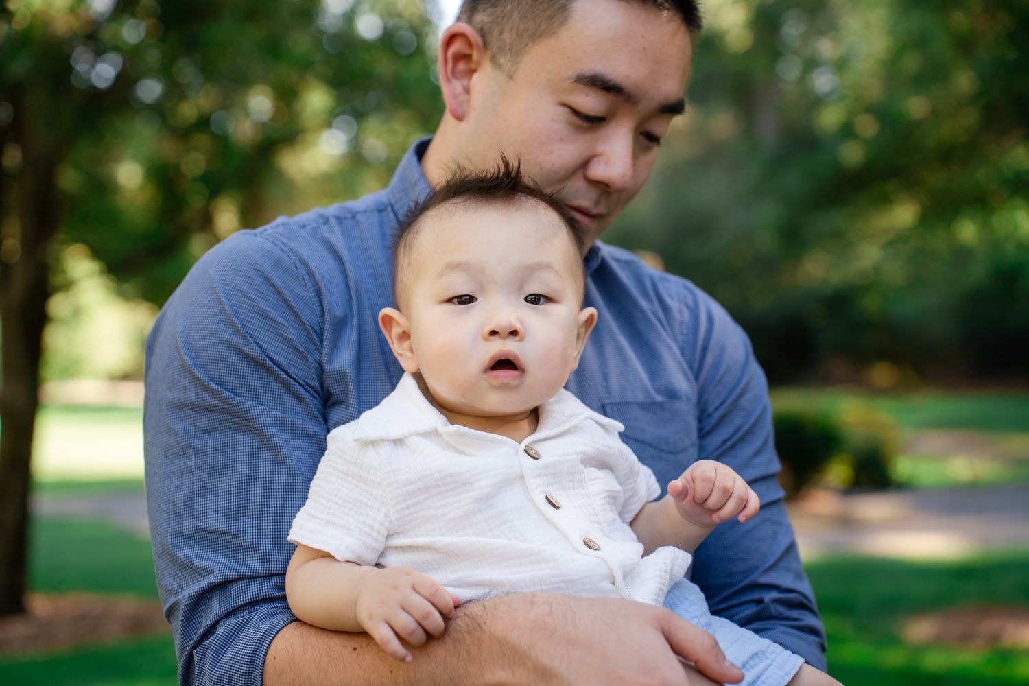 Portrait of a young boy in his father's arms