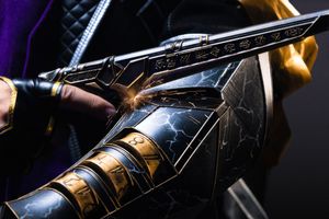 Close-up of an ornate black and gold fantasy weapon with glowing runes and lightning details.