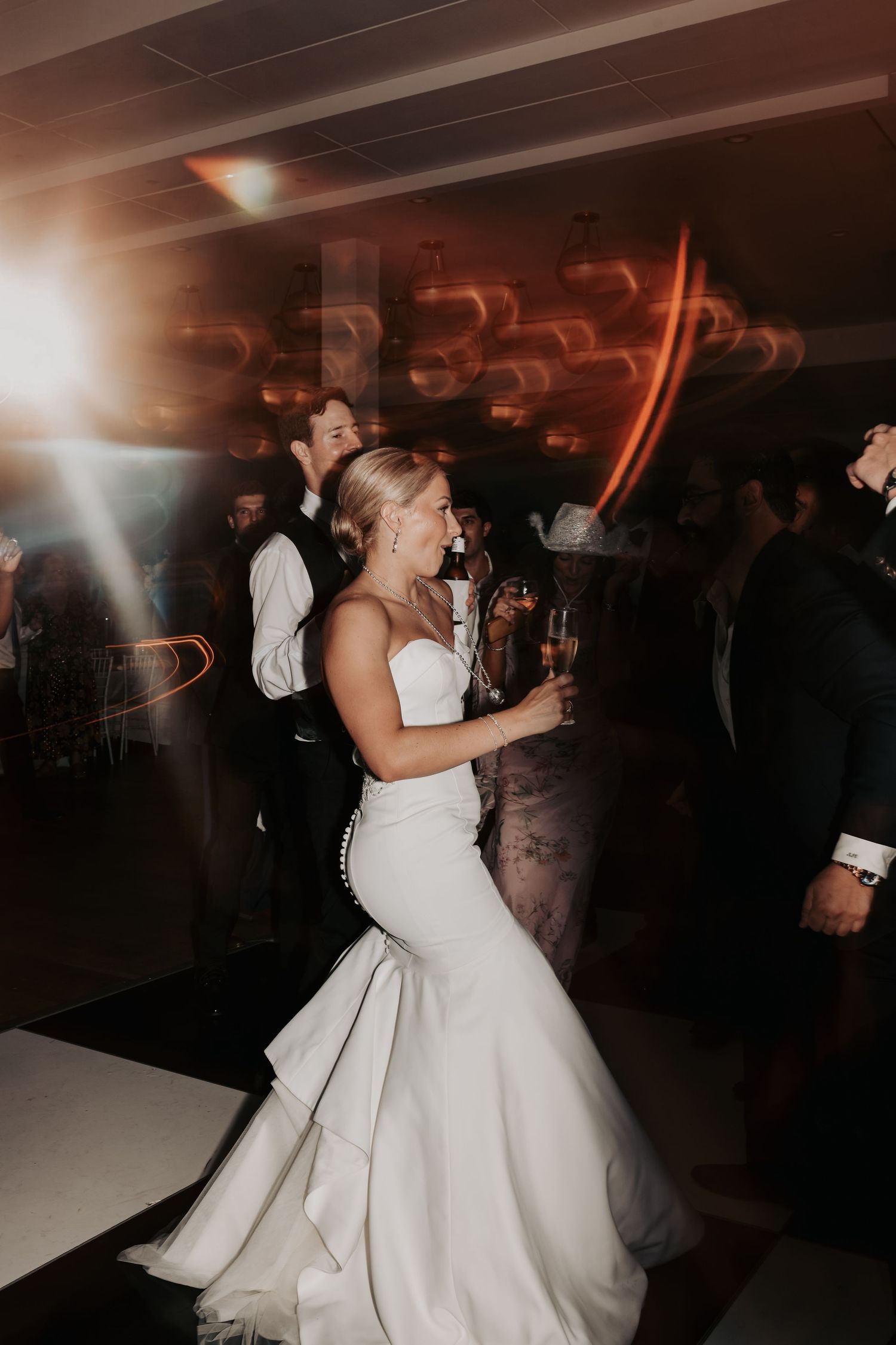 Nicole dancing with her bridesmaids during the reception