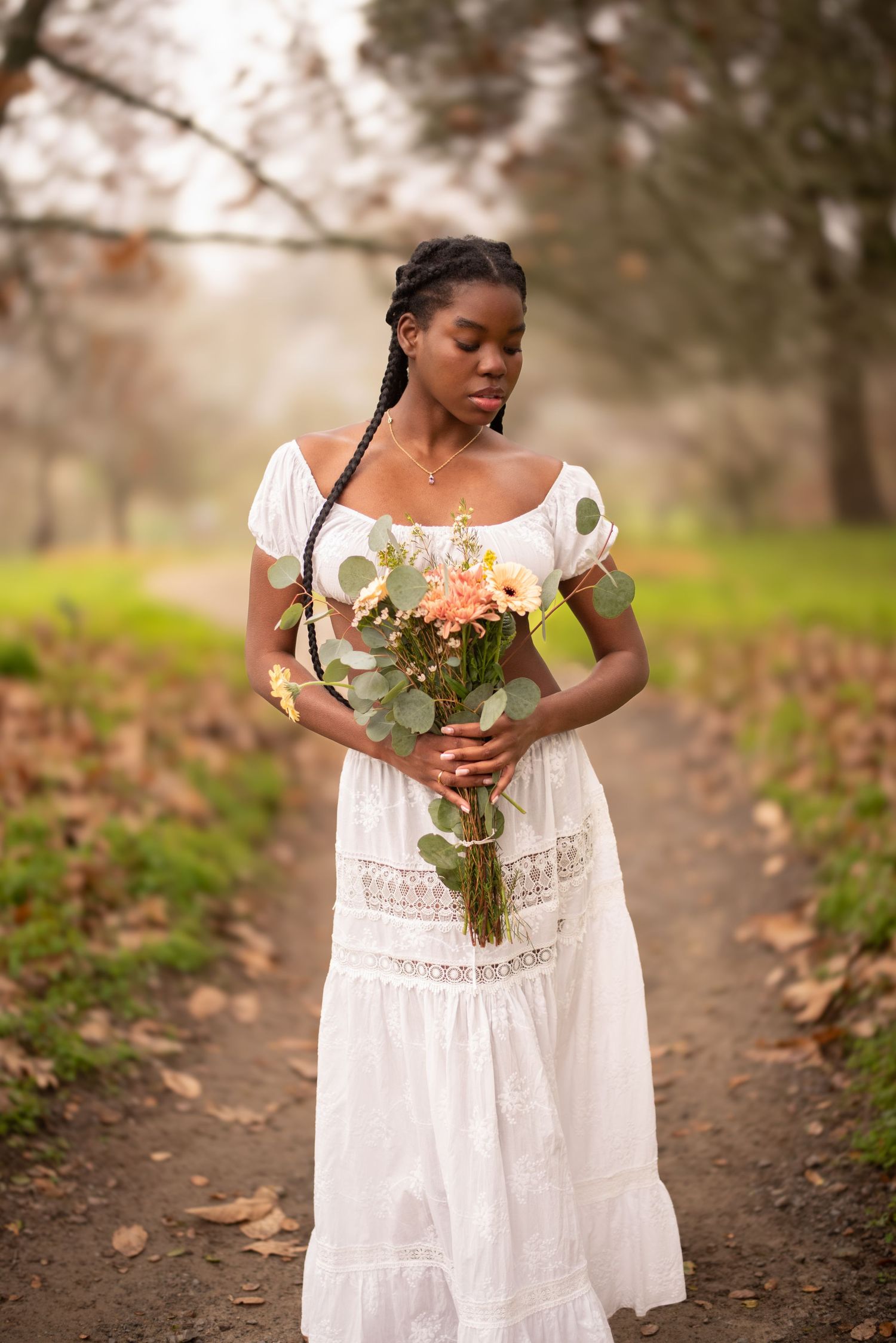 Sonoma County women’s portrait photographer creating natural outdoor portraits surrounded by flowers, soft light, and beautiful California