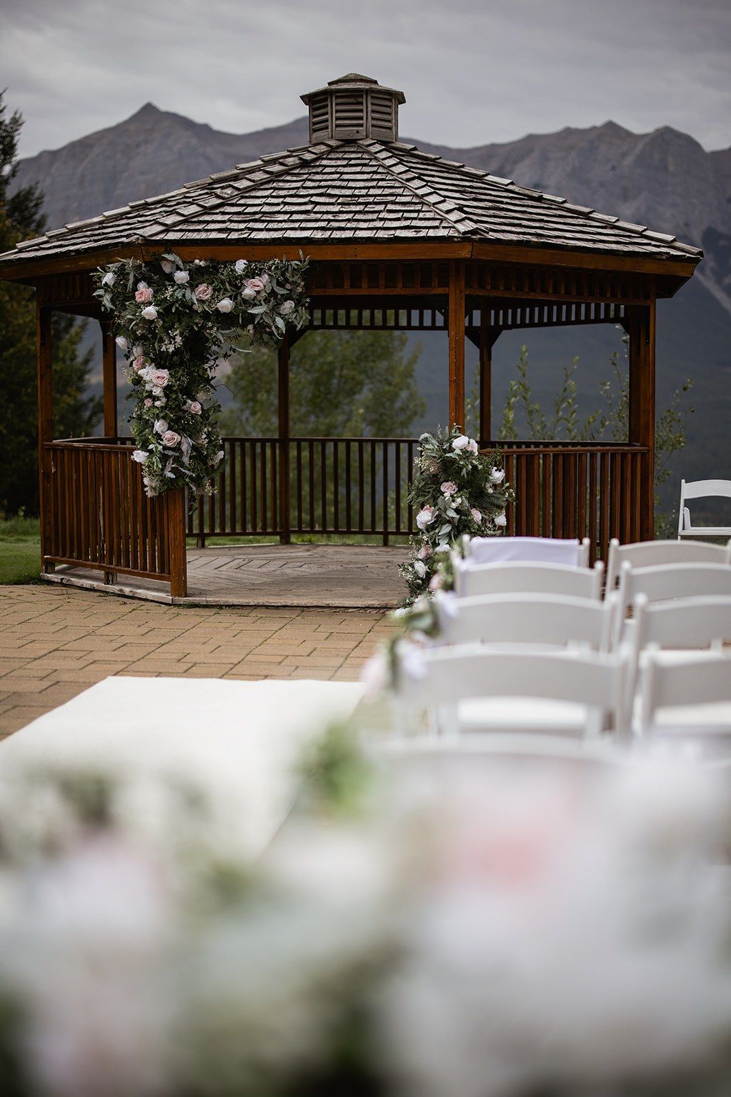 White floral arch at the Silvertip Resort Gazebo ceremony