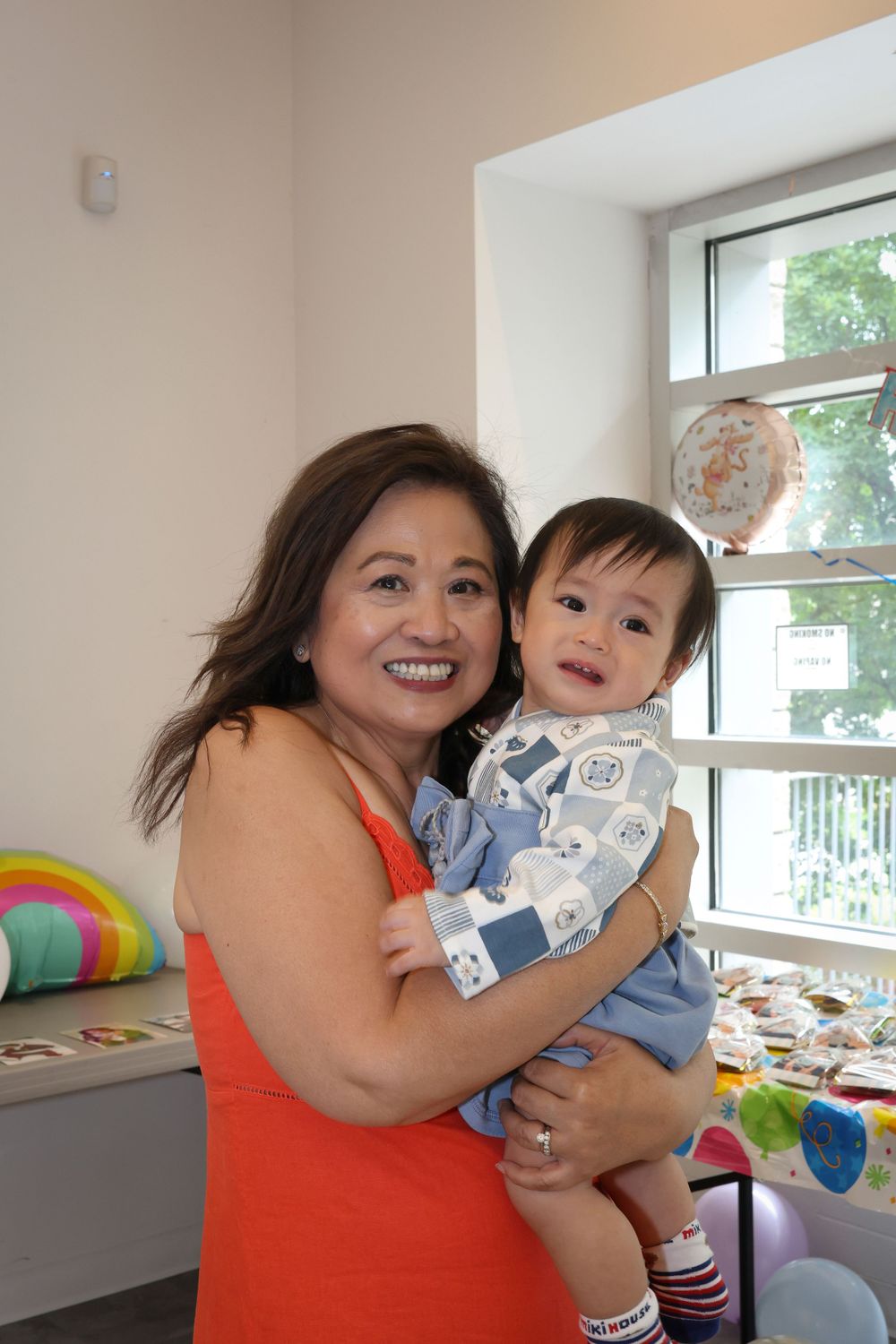 Grandma hugging baby boy