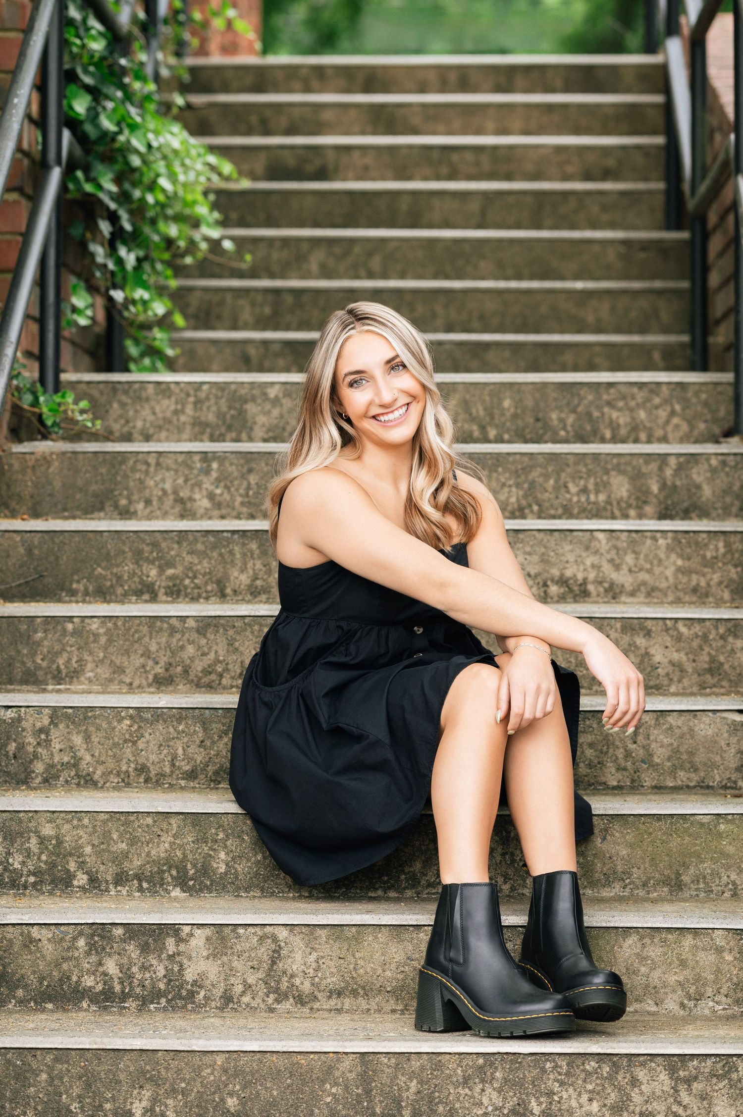 Outdoor senior portrait of a high school graduate girl, with a focus on natural expressions and personal style."