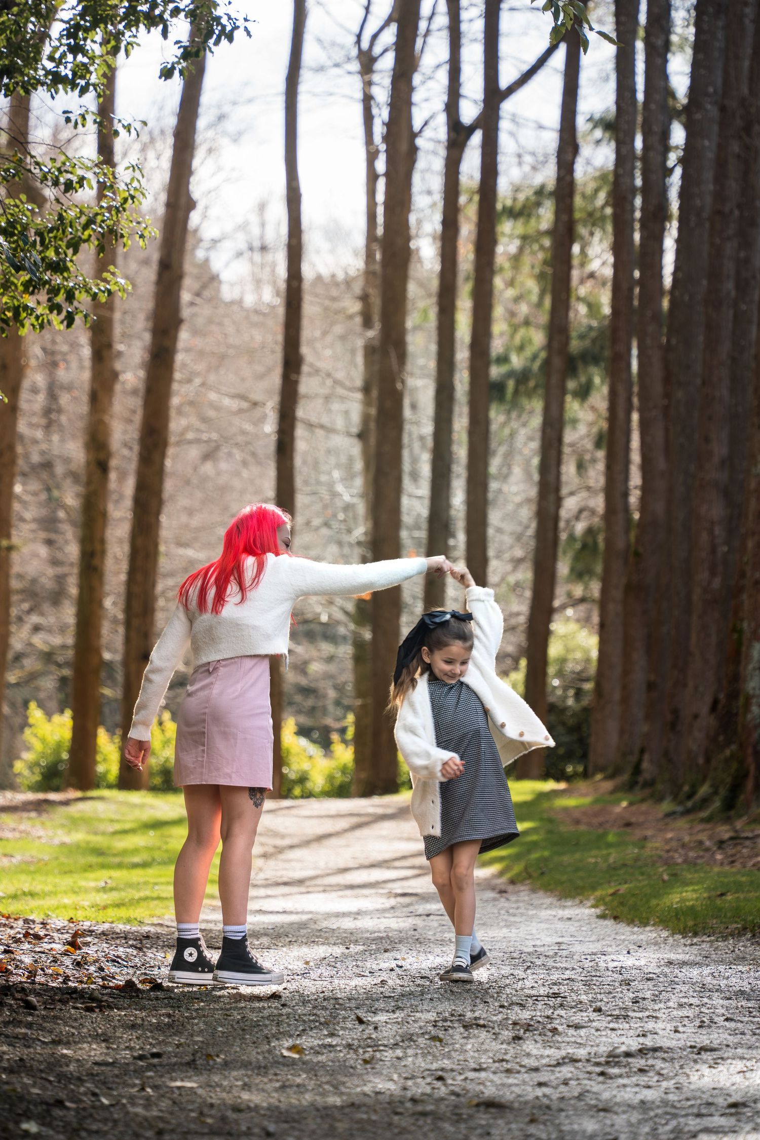 sister spinning sister for photoshoot art park