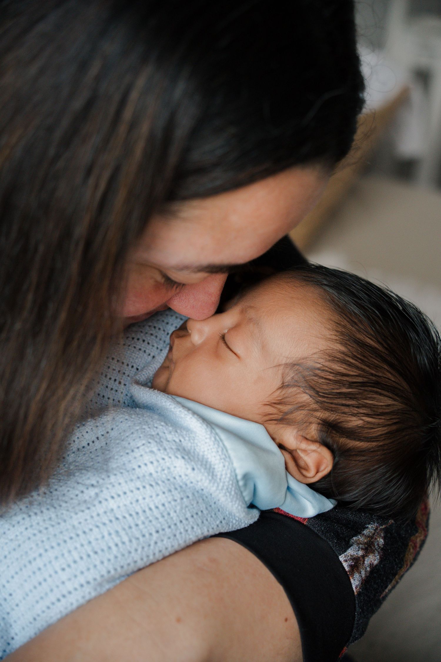Mum holding newborn baby photoshoot