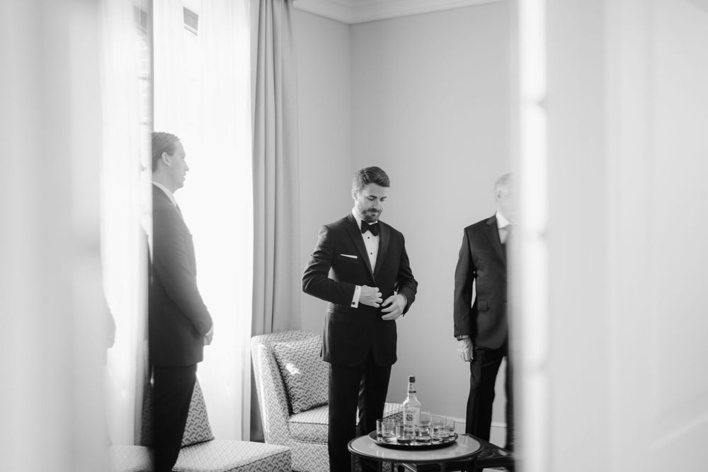Black and white photos of wedding preparations with silhouettes in formal attire. Photoshoot by Venice Photographer Alina Indi