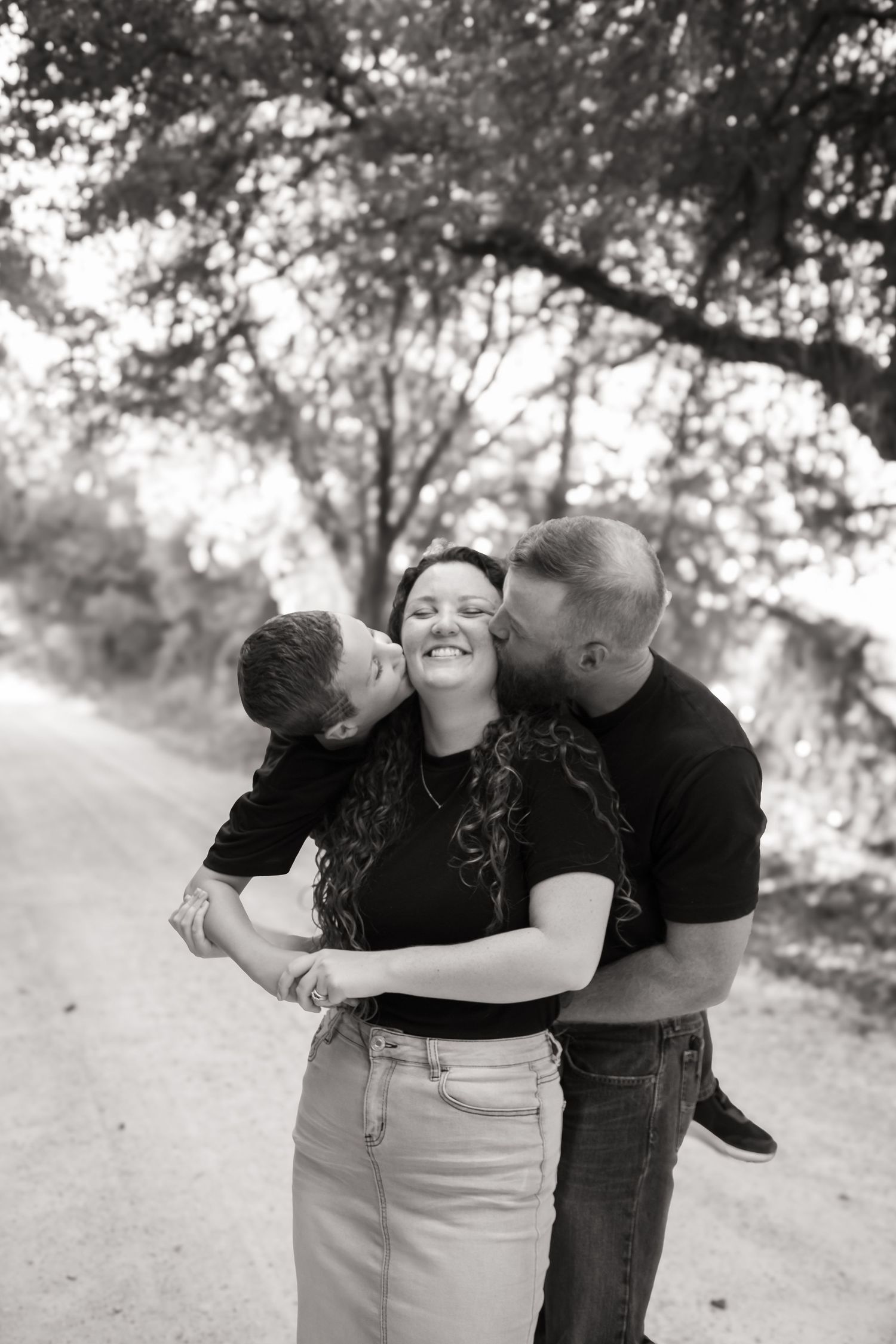 Family hugging in Stephenville Texas, Couples in Glenrose Texas,  Stephenville Couples Photographer,