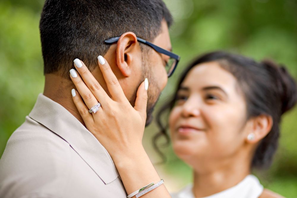 A series of six connected photos showing two people in profile embracing outdoors with a green background.