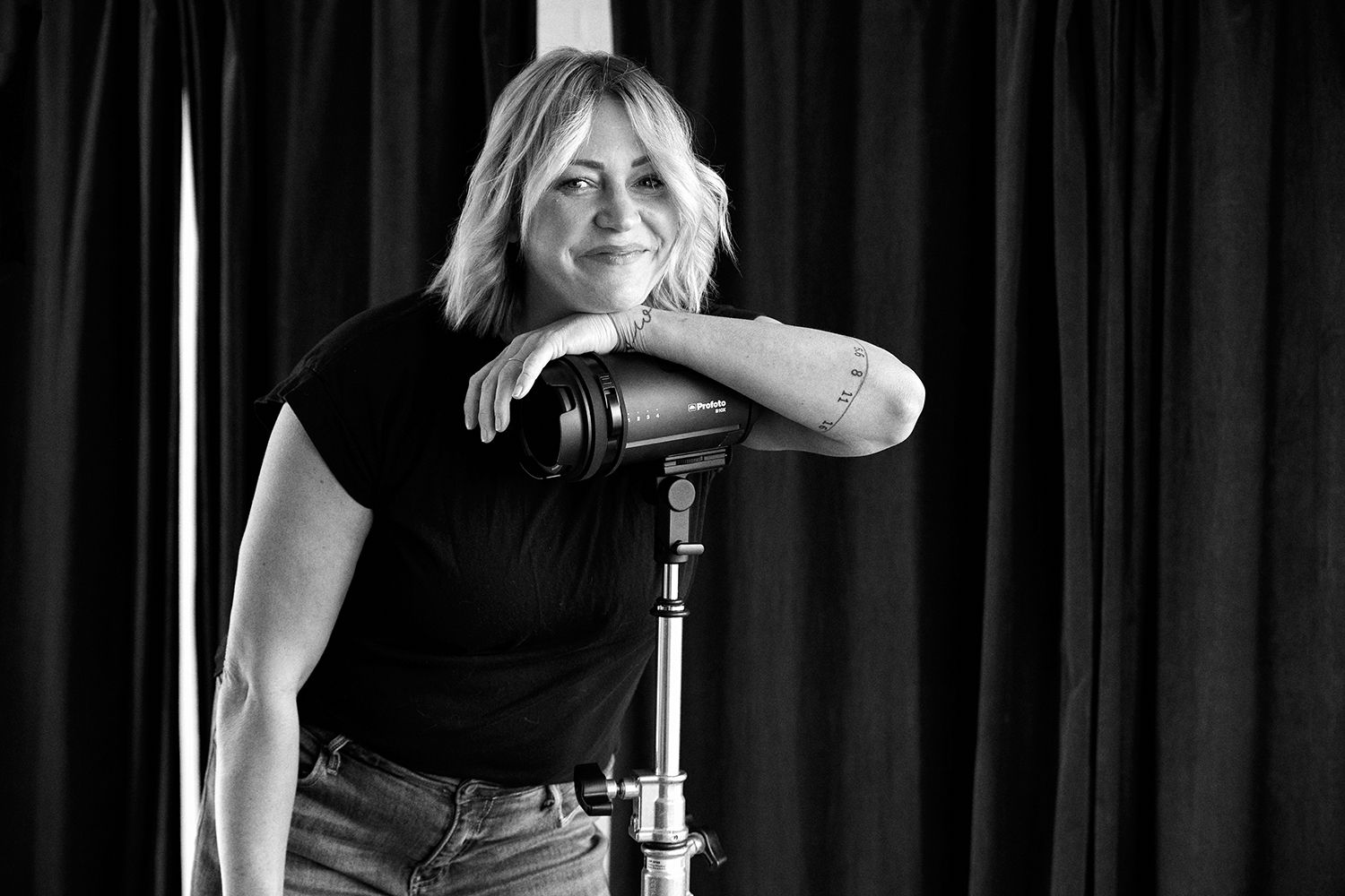 Black and white portrait series showing dramatic lighting and expressions in a studio setting.