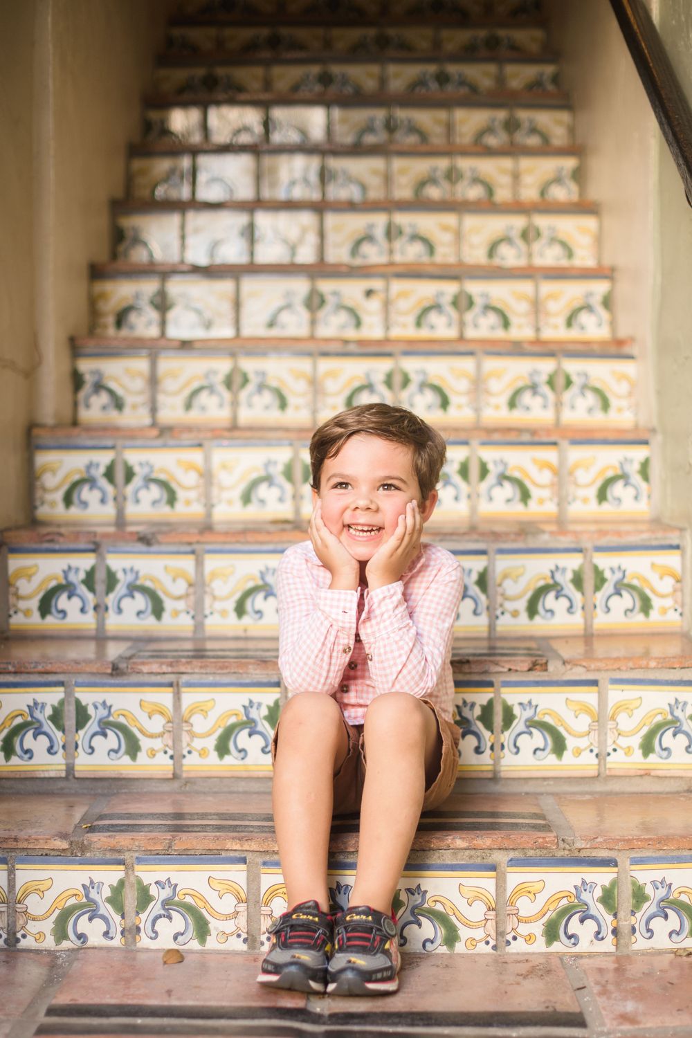 Decorative tiled steps with intricate blue and white patterns create a beautiful architectural backdrop.