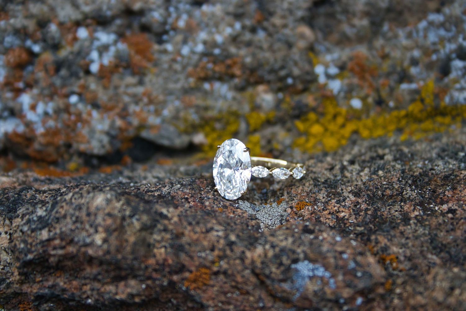 Engagement ring on stones of Ruins in Estes Park, Colorado. Pixcapades | The Rocky Mountain Proposal Photographer