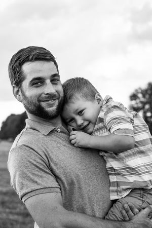 dad and son portrait in a field from a family session in Cartersville