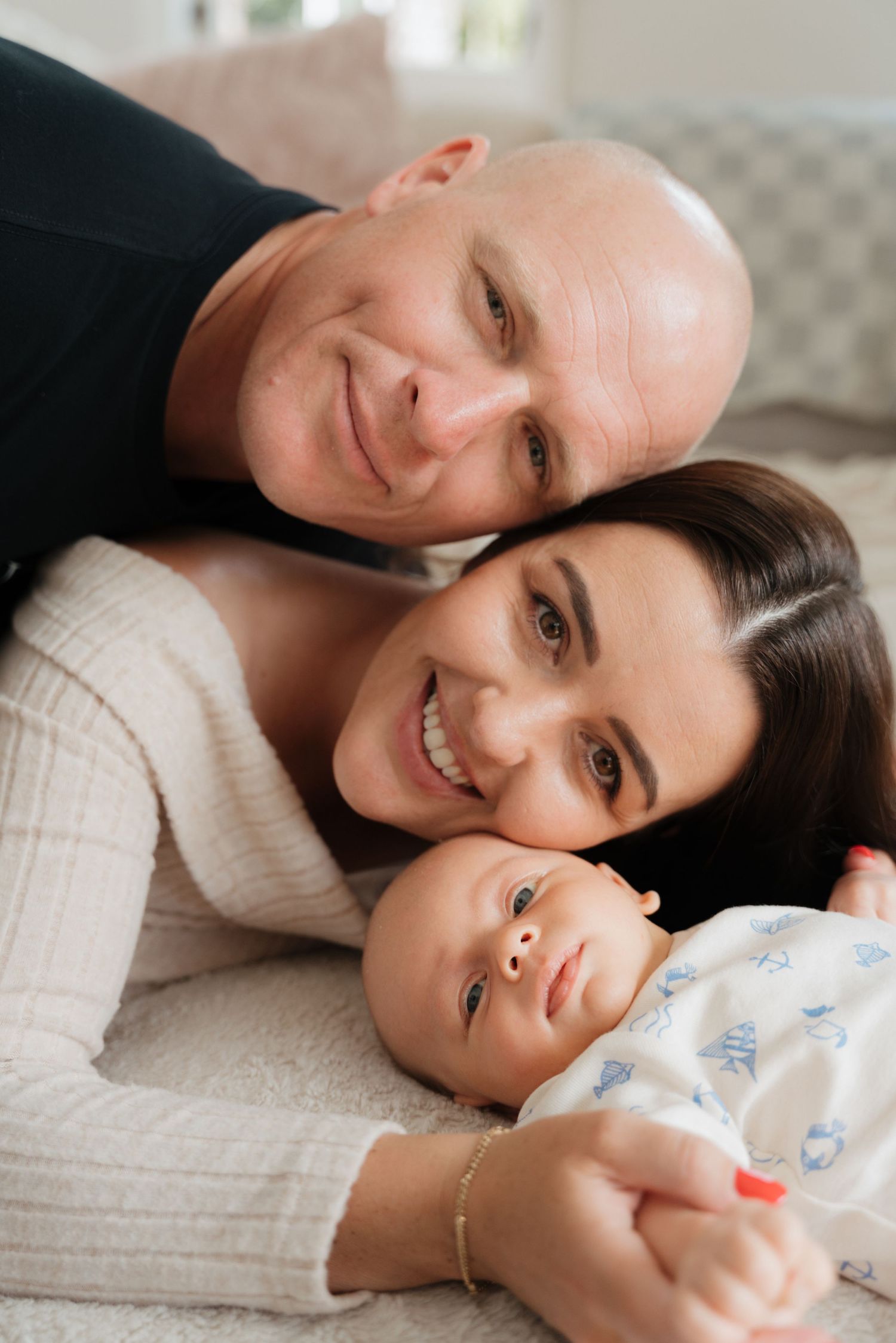 Cozy indoor family portrait showing emotional connection and warmth.